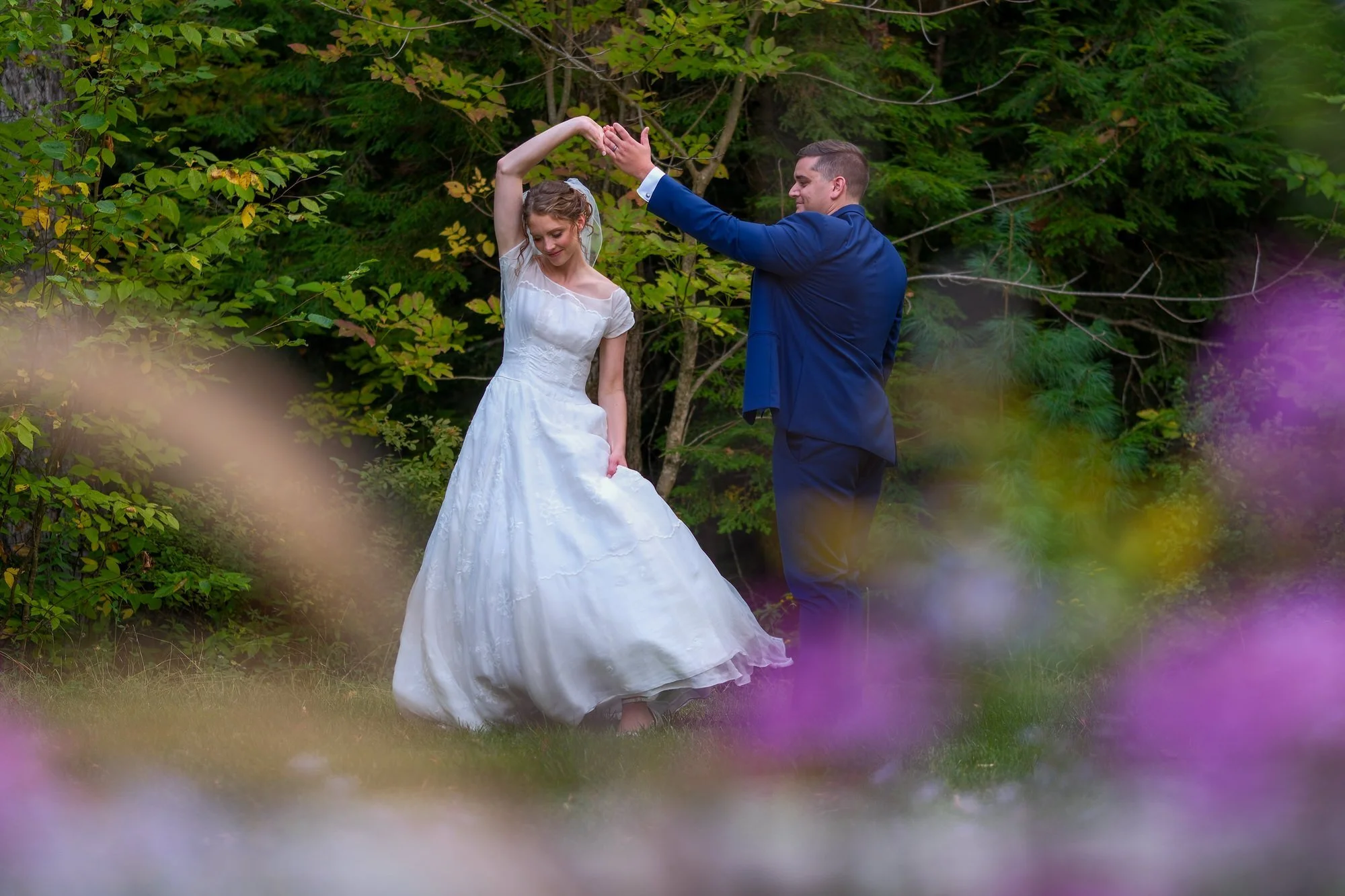 locke-falls-farm-wedding-couple-twirl-garden-white-mountains-nh.jpg