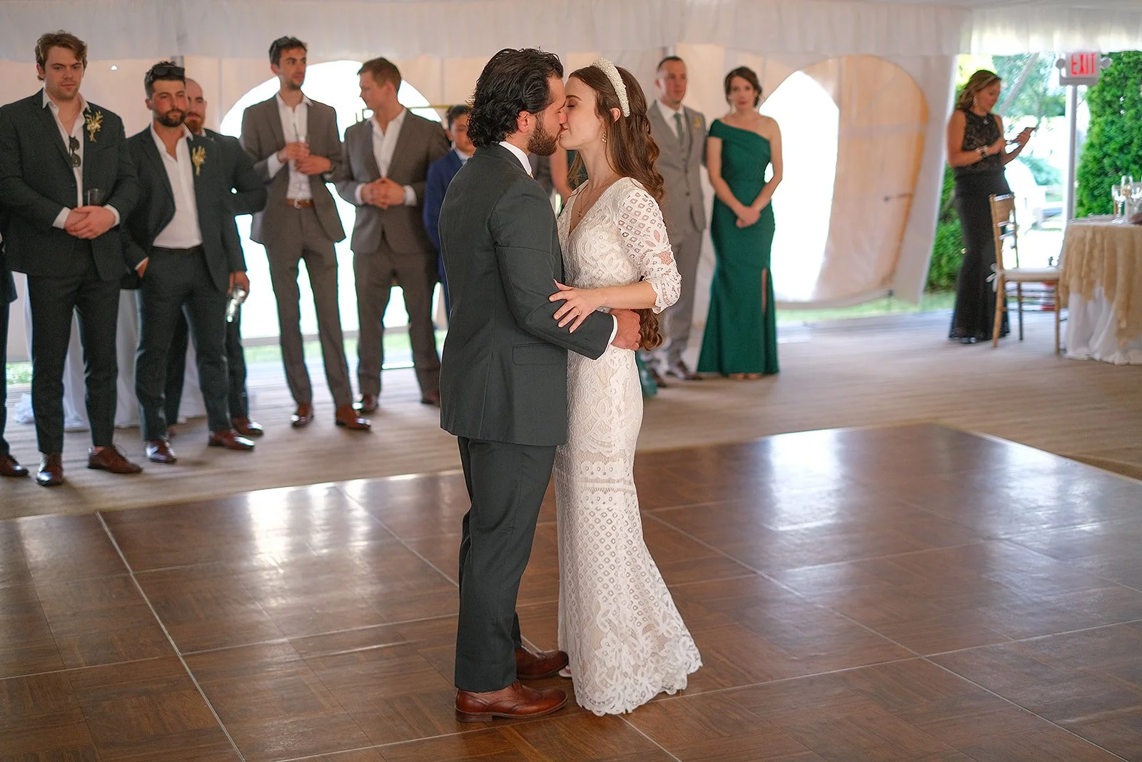 A bride and groom share their first dance at a wedding ceremony.