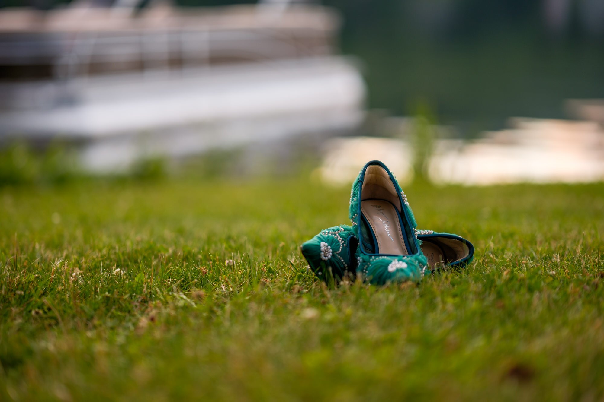 Bride's teal wedding shoes photographed near Lake Morey Resort in Vermont
