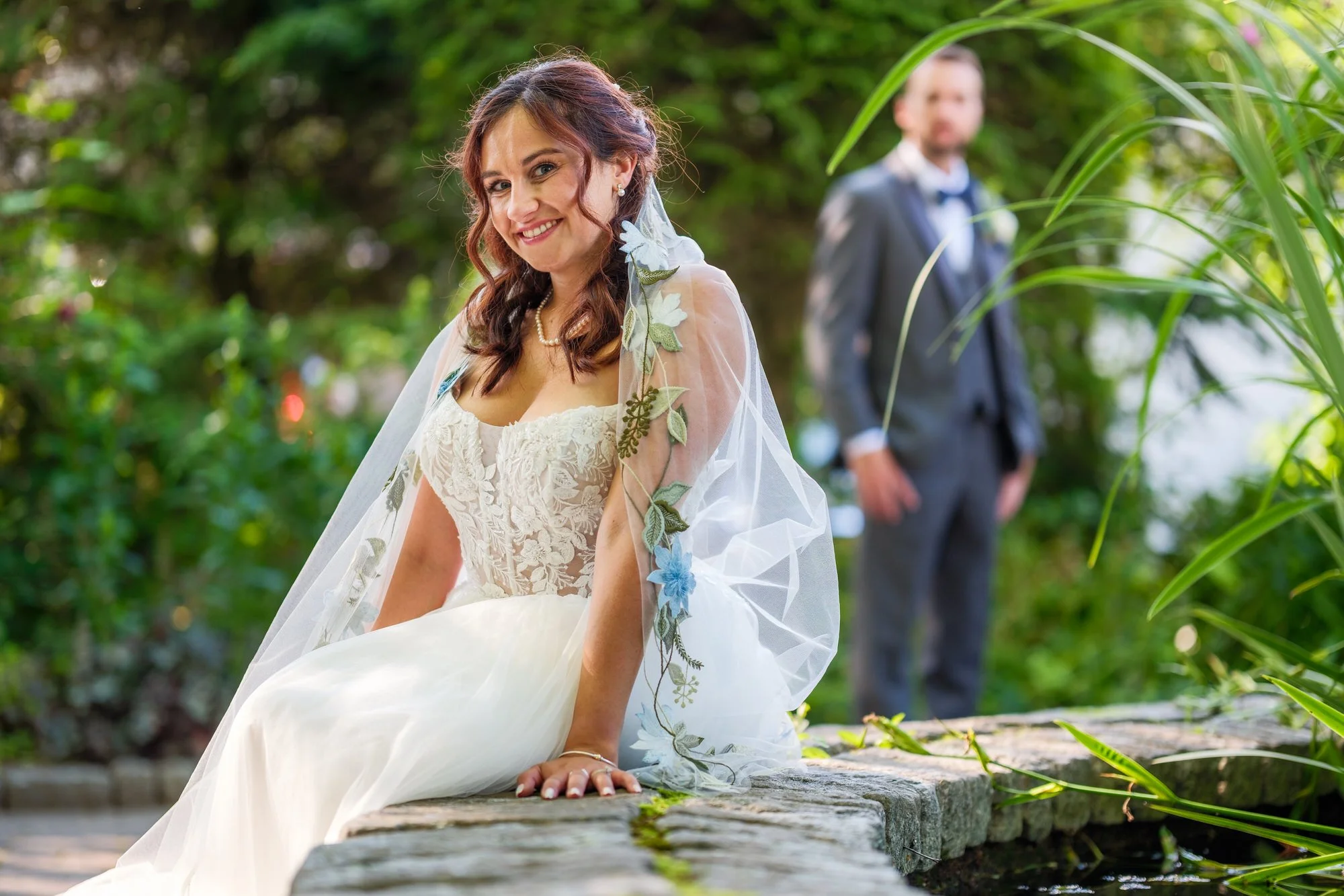 Bridal portrait on stone wall at Lake Morey Resort wedding in Vermont