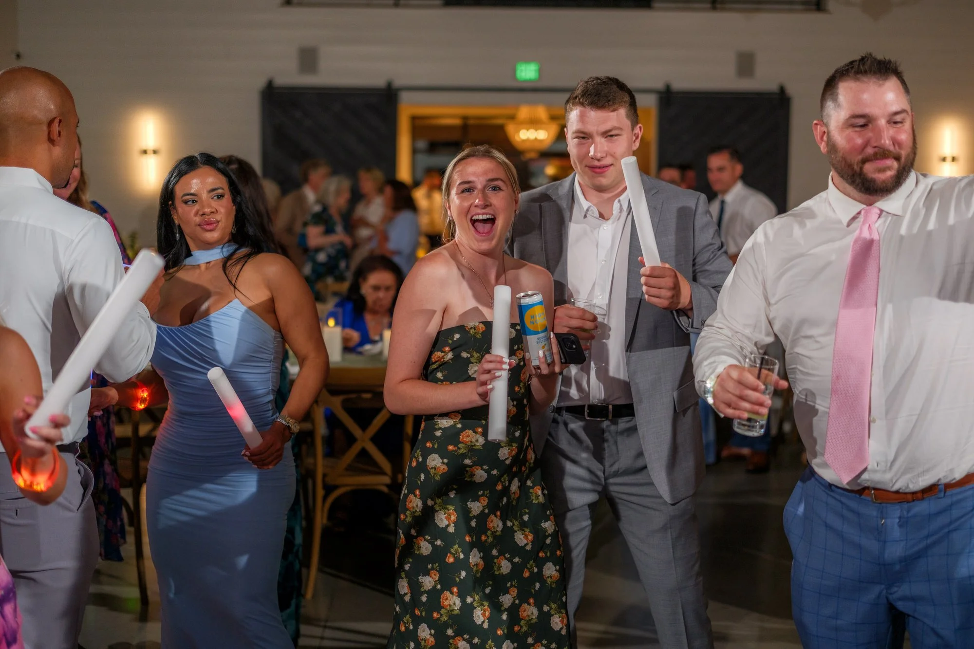 Wedding guests celebrating on the dance floor at Hyla Brook Estate