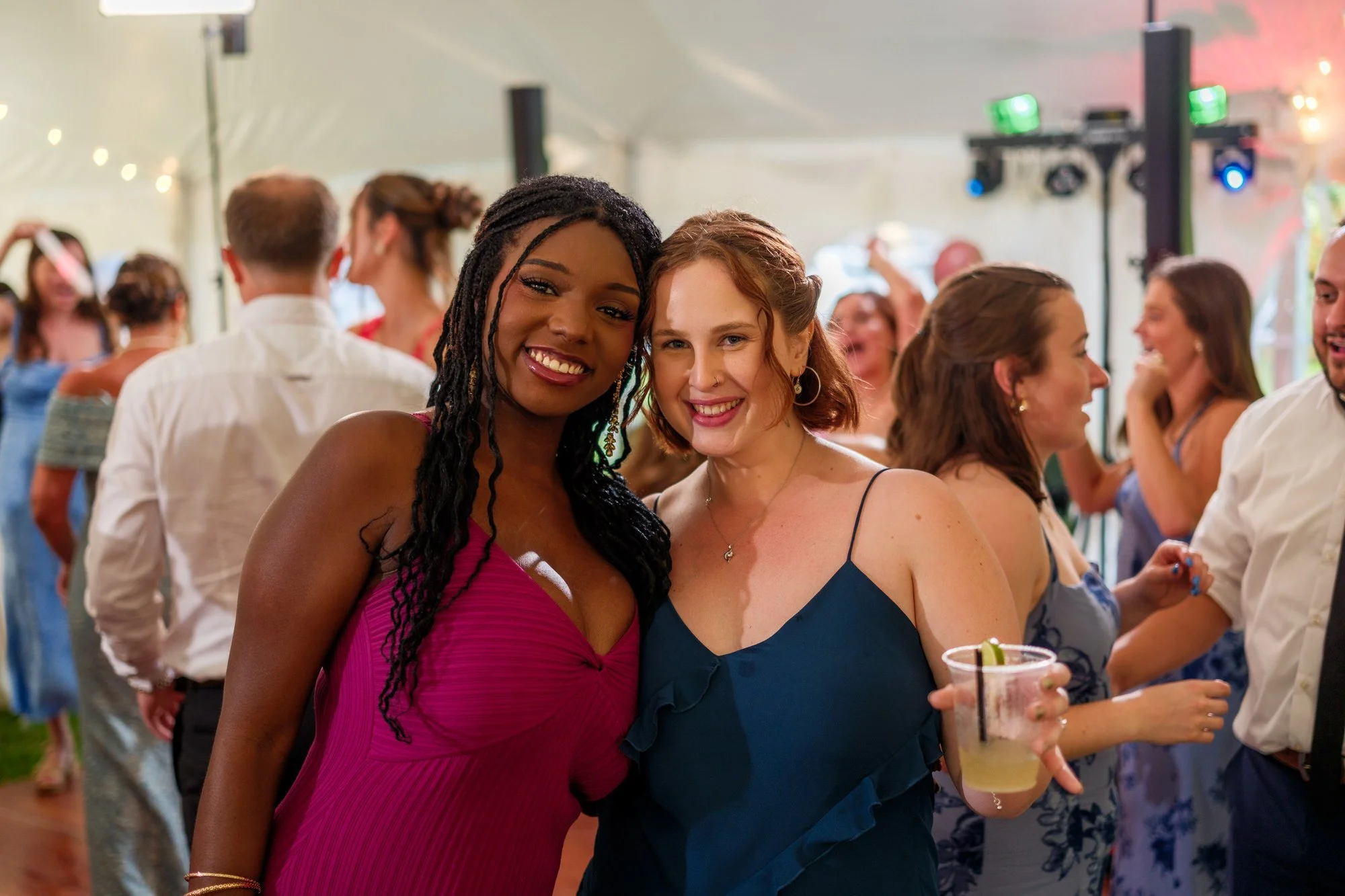 Wedding guests smile for a reception portrait at Lake Morey Resort in Vermont