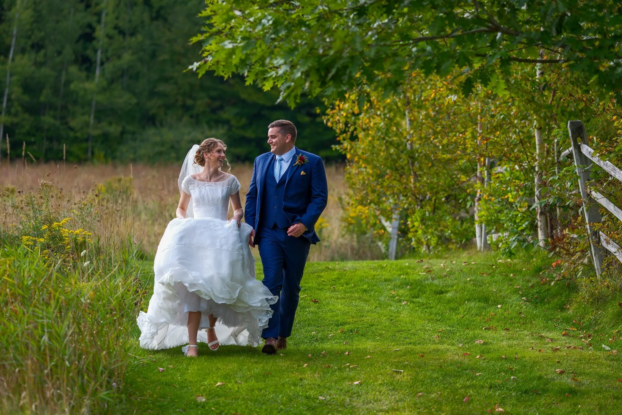 locke-falls-farm-wedding-couple-walking-white-mountains-nh.jpg