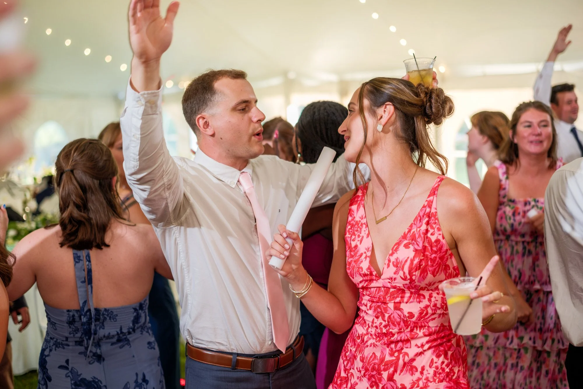 Guests dance together at a lively Lake Morey Resort wedding reception
