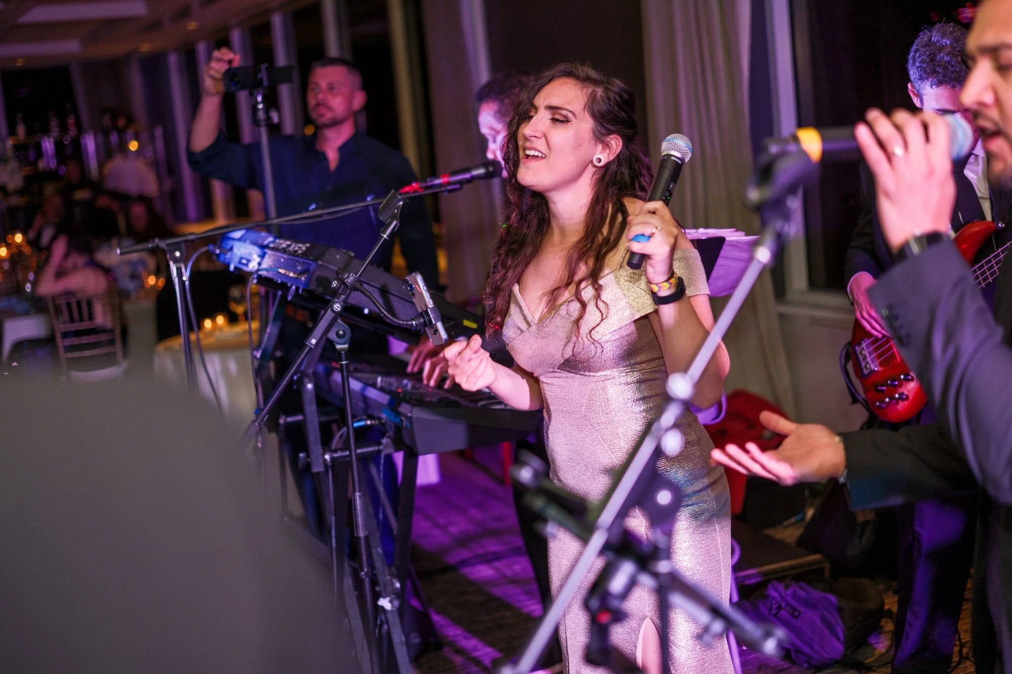 Guests celebrating on the UMass Club Boston wedding dance floor during the evening reception