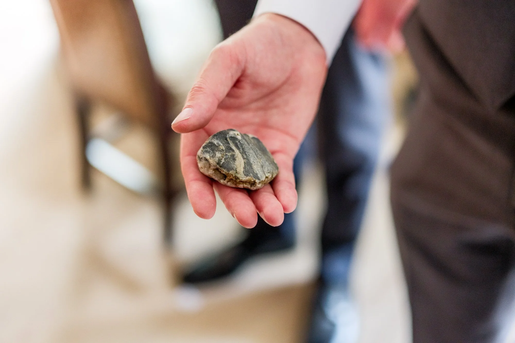 Groom holds sentimental wedding keepsake during Lake Morey Resort wedding prep