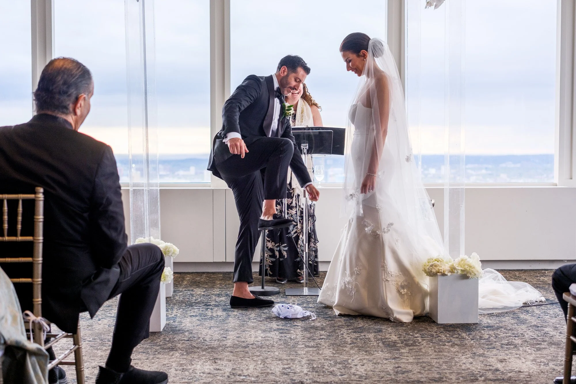 Groom stomping on the glass during the traditional Jewish wedding ceremony at the UMass Club Boston