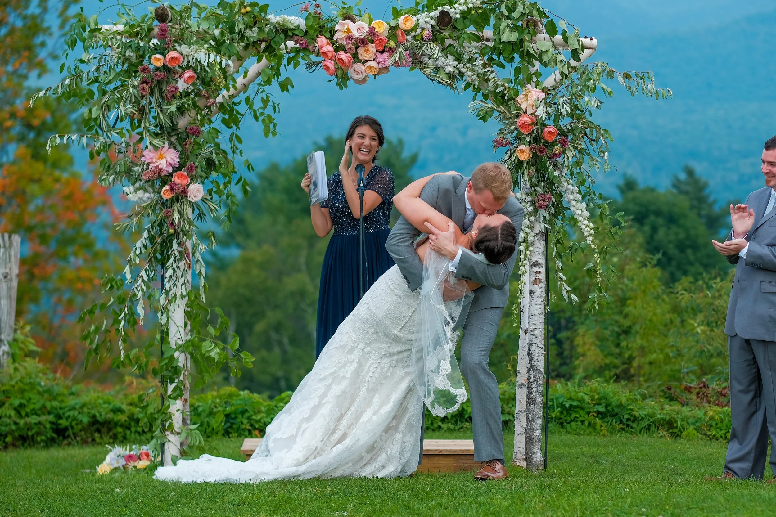 toad-hill-farm-franconia-nh-ceremony-dip-kiss-floral-arch.jpg