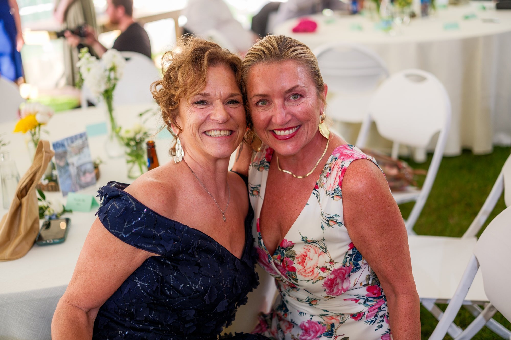 Two wedding guests pose together at Lake Morey Resort reception