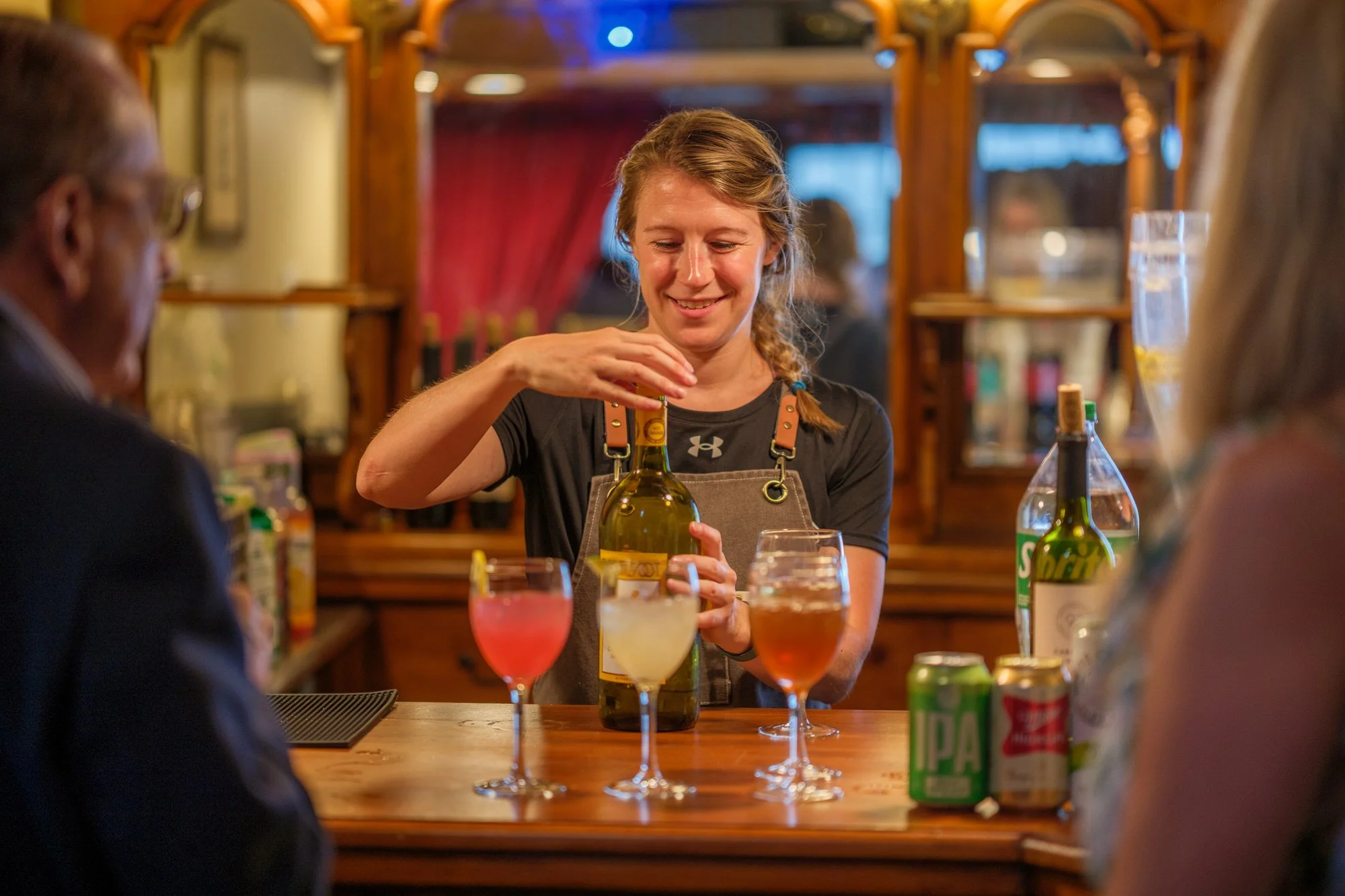 Bartender preparing colorful cocktails at the wedding reception