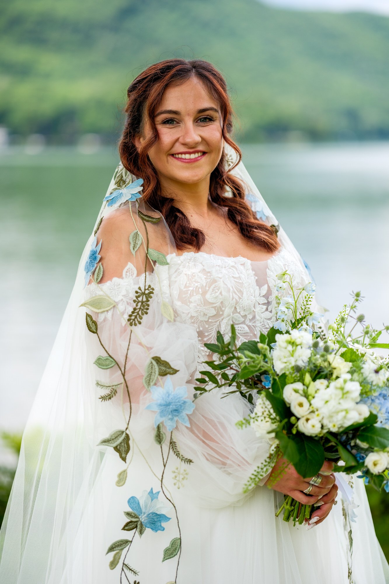Lakeside bridal portrait with bouquet at Lake Morey Resort in Fairlee, Vermont