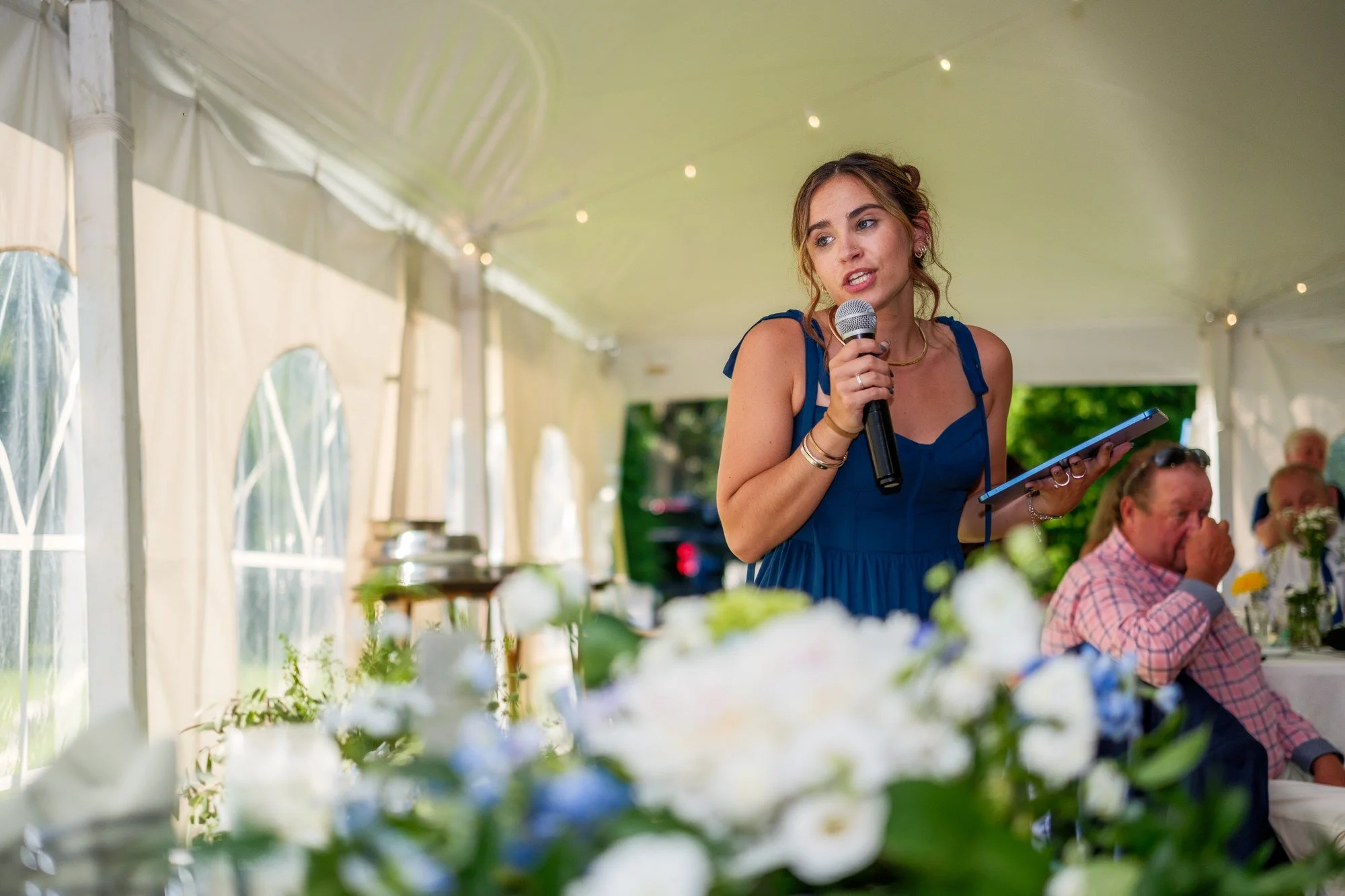 Wedding toast during tented reception at Lake Morey Resort in Fairlee, Vermont