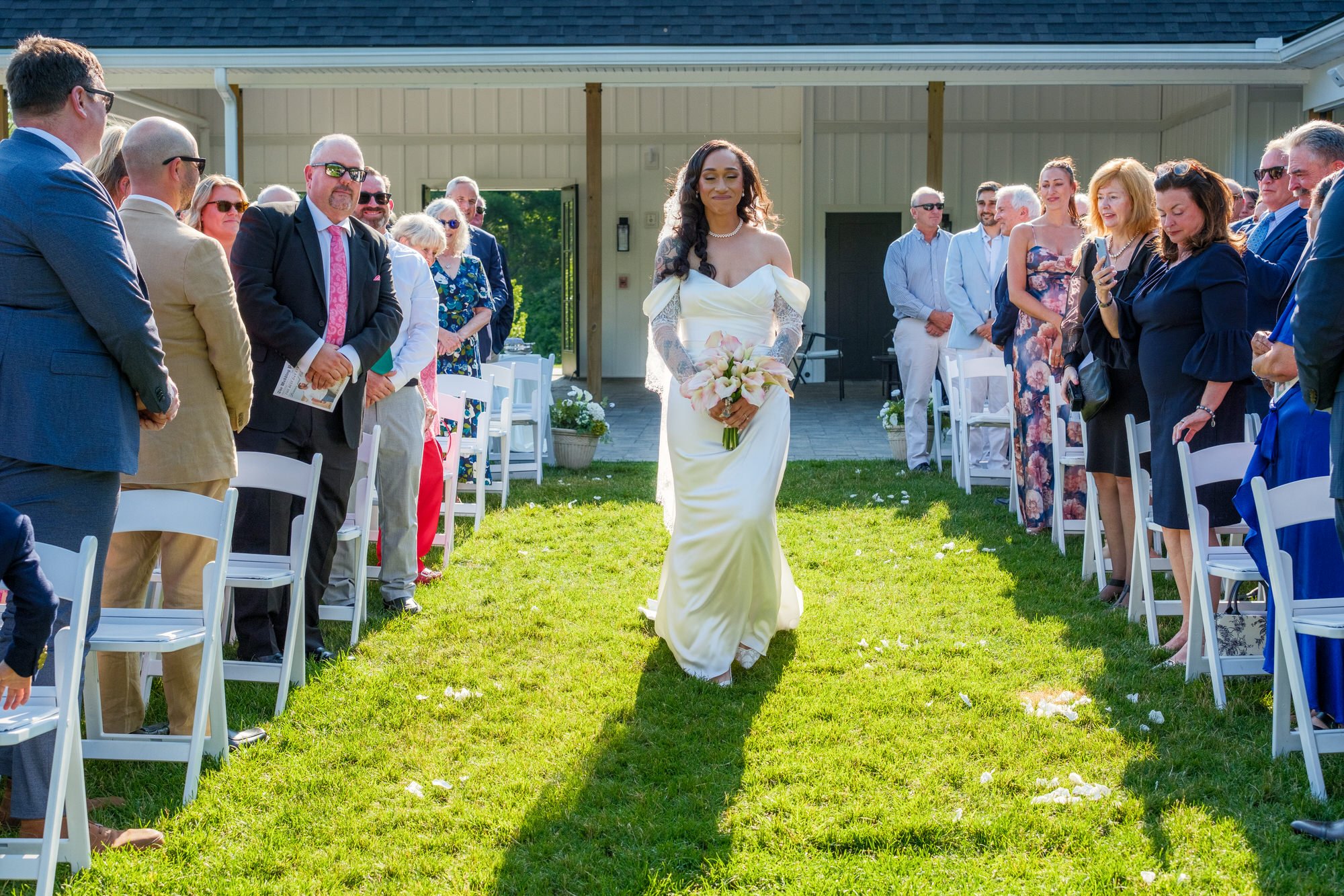 Bride walking down the aisle at Hyla Brook Estate in Derry, New Hampshire
