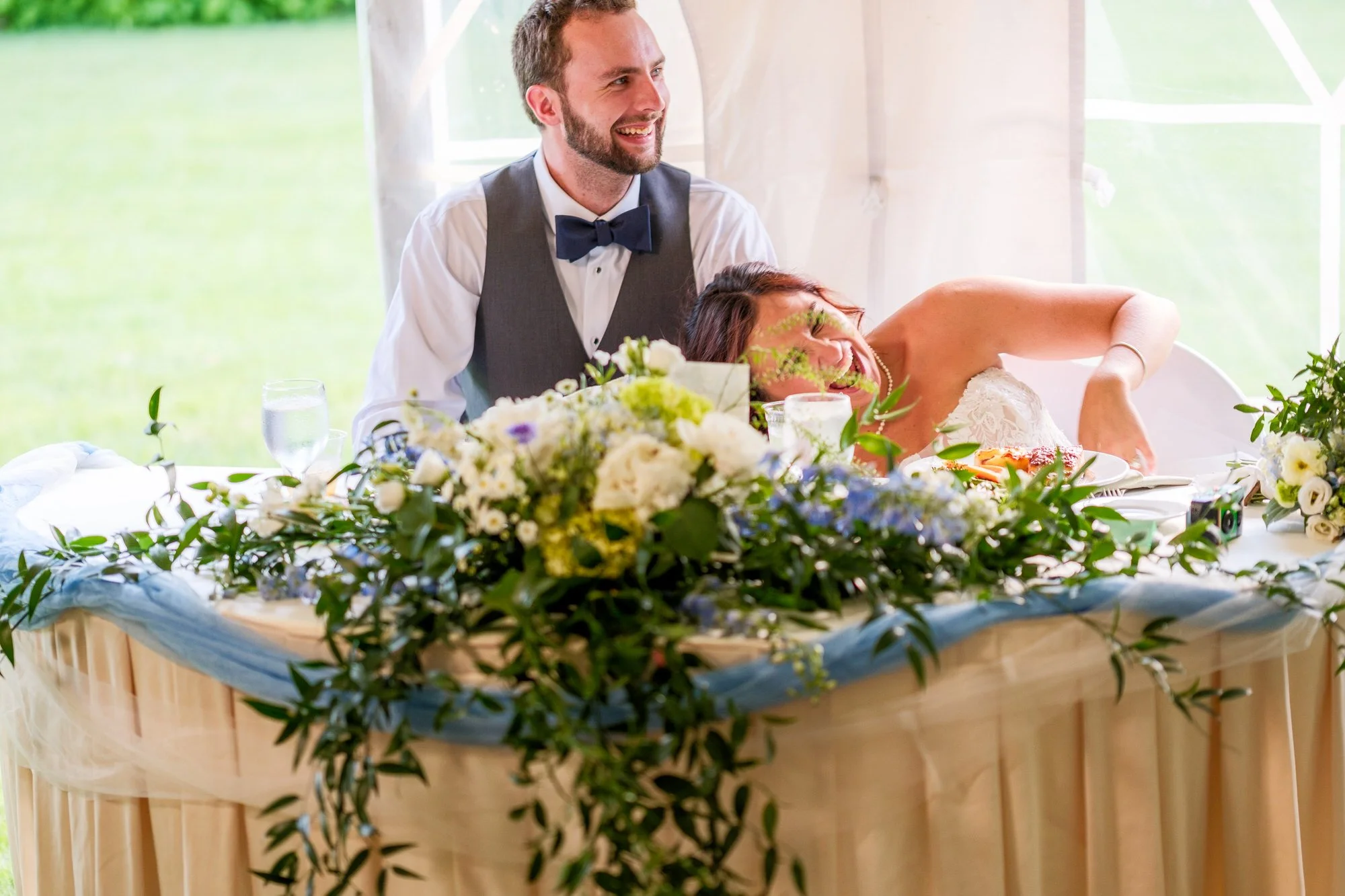 Newlyweds react during heartfelt speeches at Lake Morey Resort reception