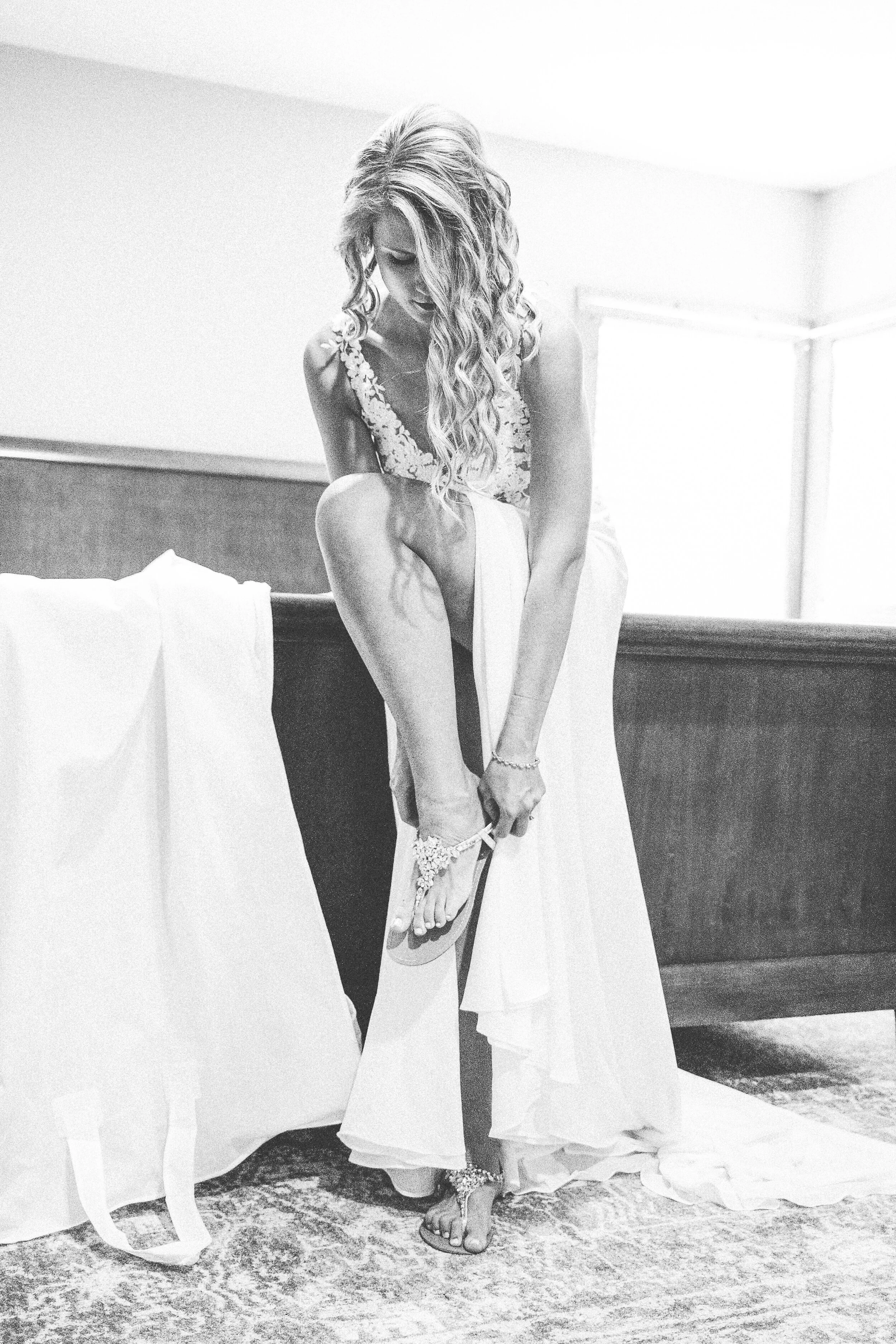 cape-cod-bride-getting-ready-shoes-black-and-white-ma.jpeg