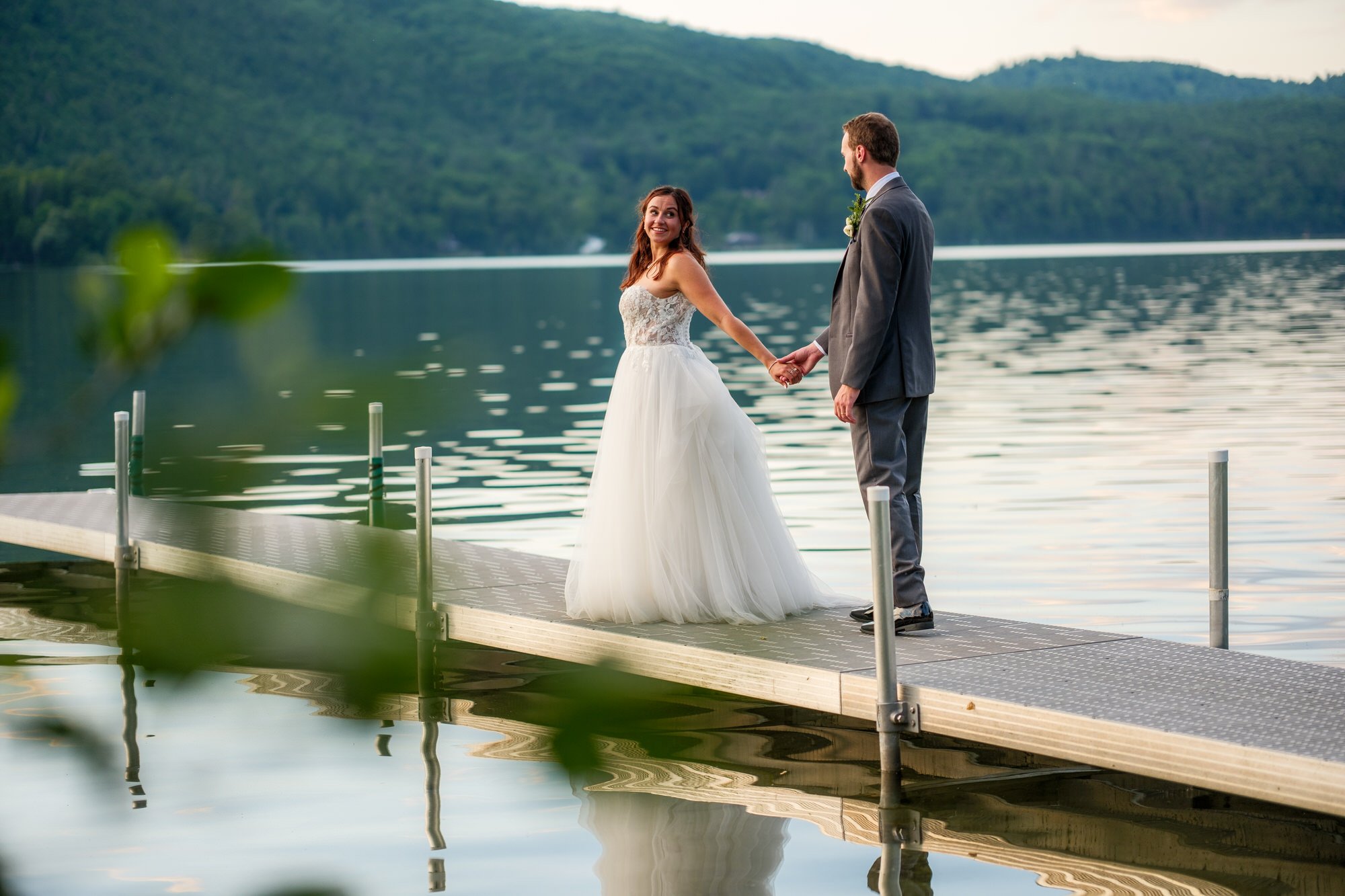 Bride and groom portrait on the dock at Lake Morey Resort in Vermont