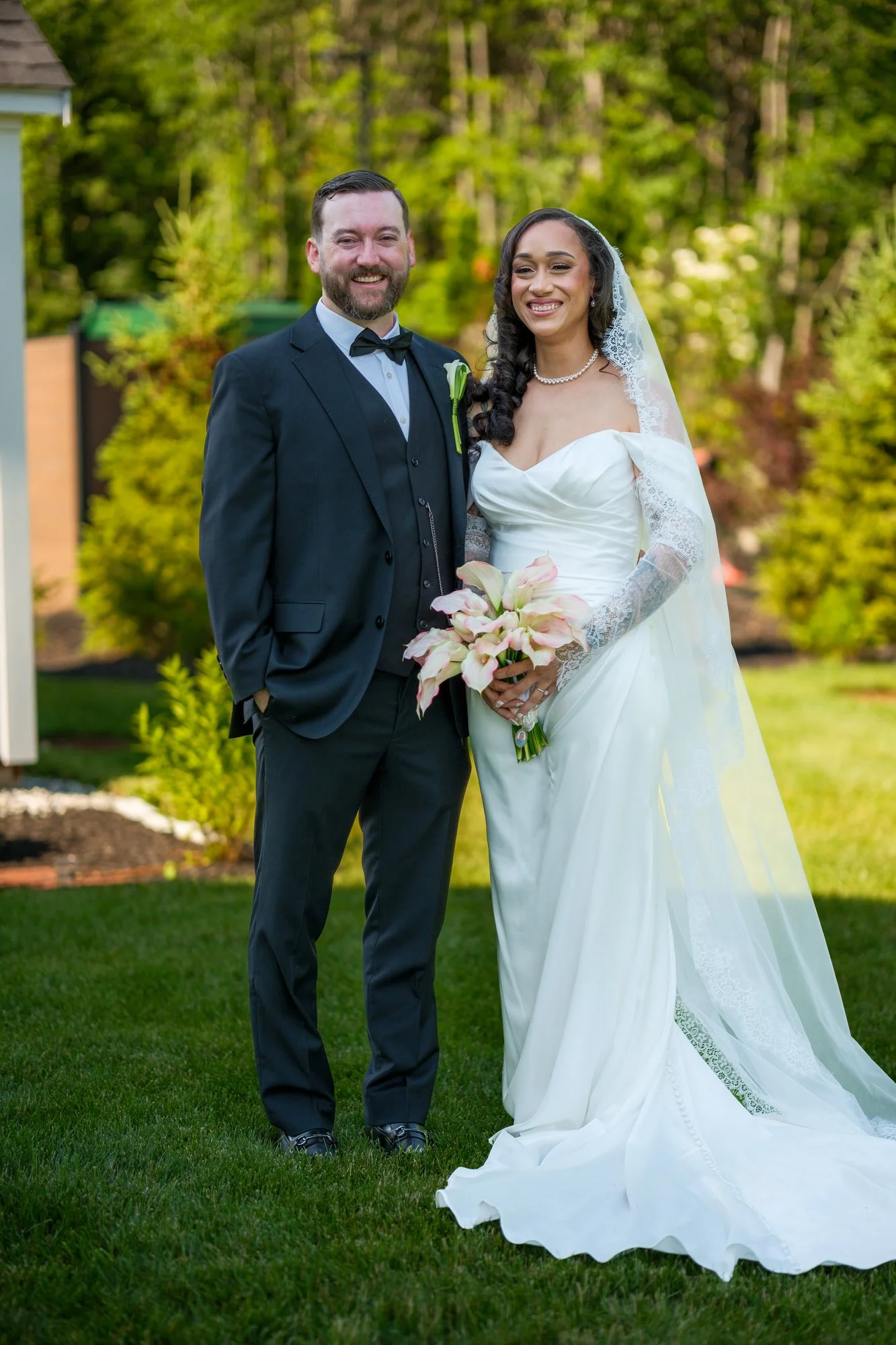 Bride and groom wedding portrait on the lawn at Hyla Brook Estate
