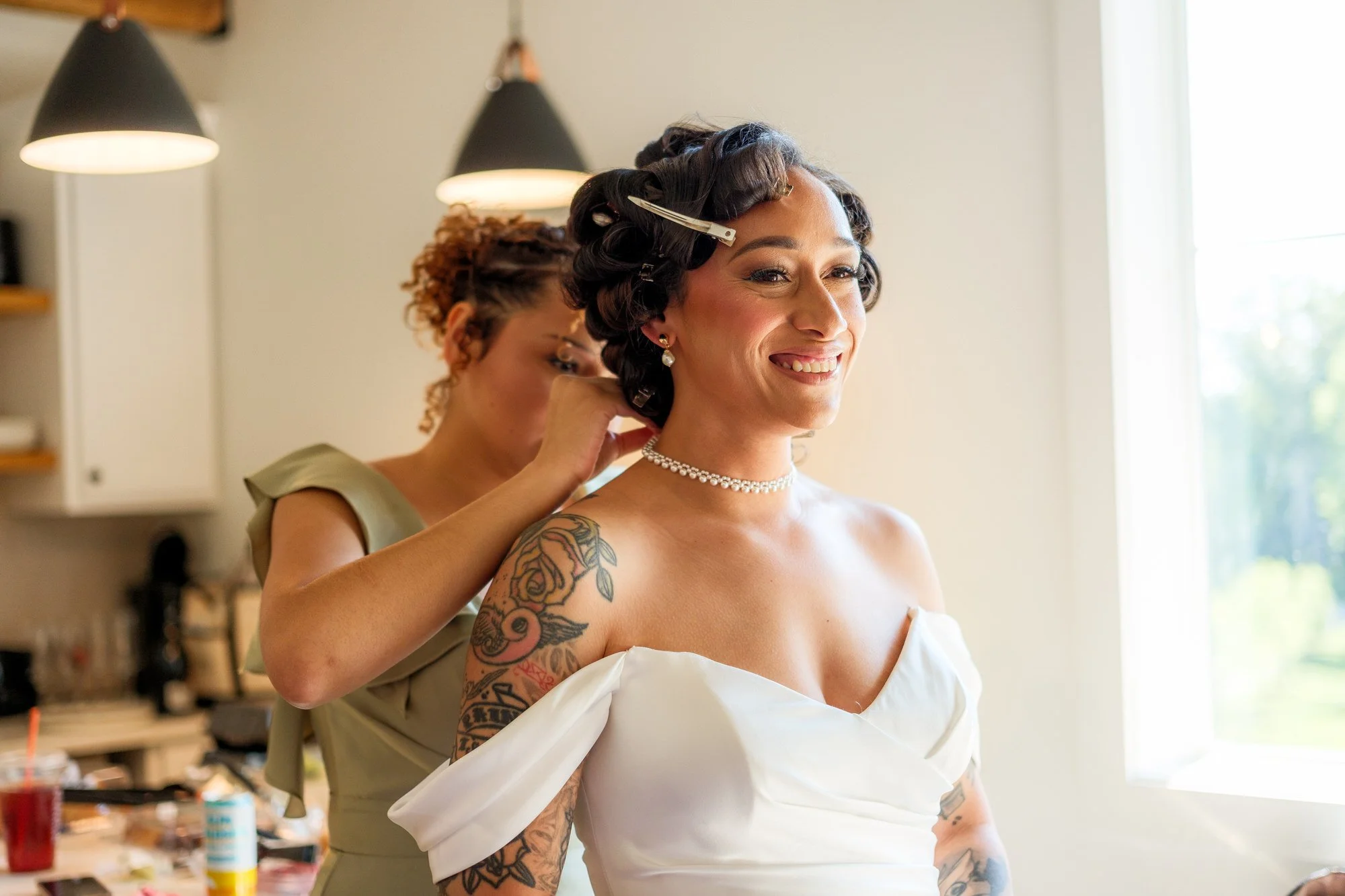 Bride getting ready with pearl necklace before her Hyla Brook Estate wedding