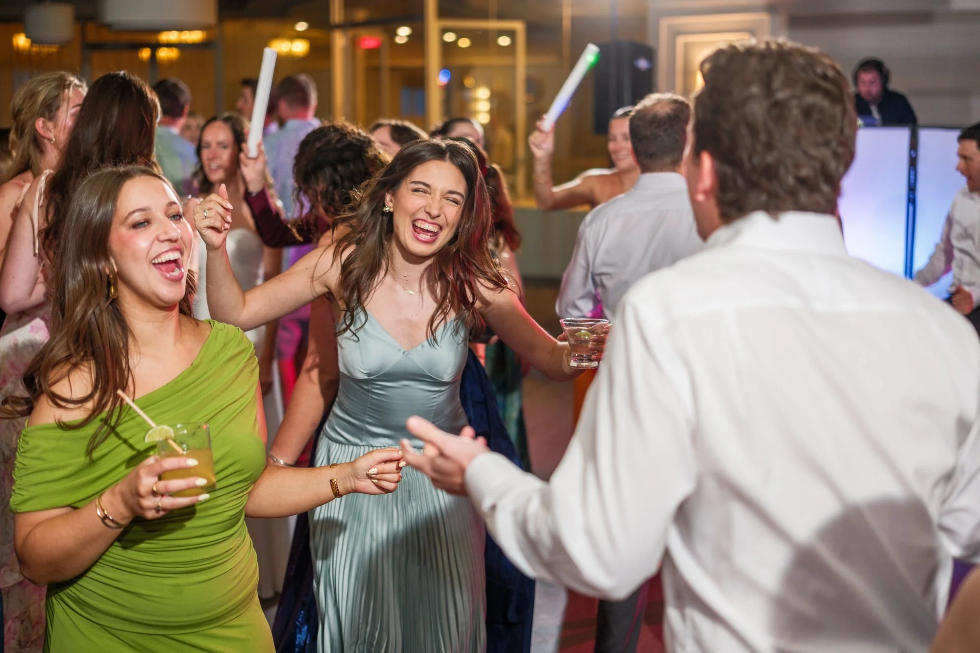 Crowded reception dance floor with guests celebrating at Blue Ocean Event Center.
