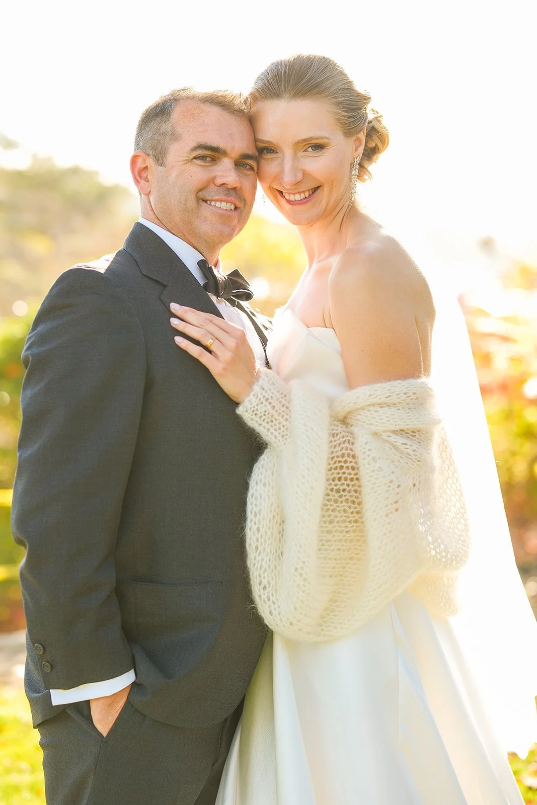 Golden hour portrait of smiling bride and groom at York Maine outdoor wedding
