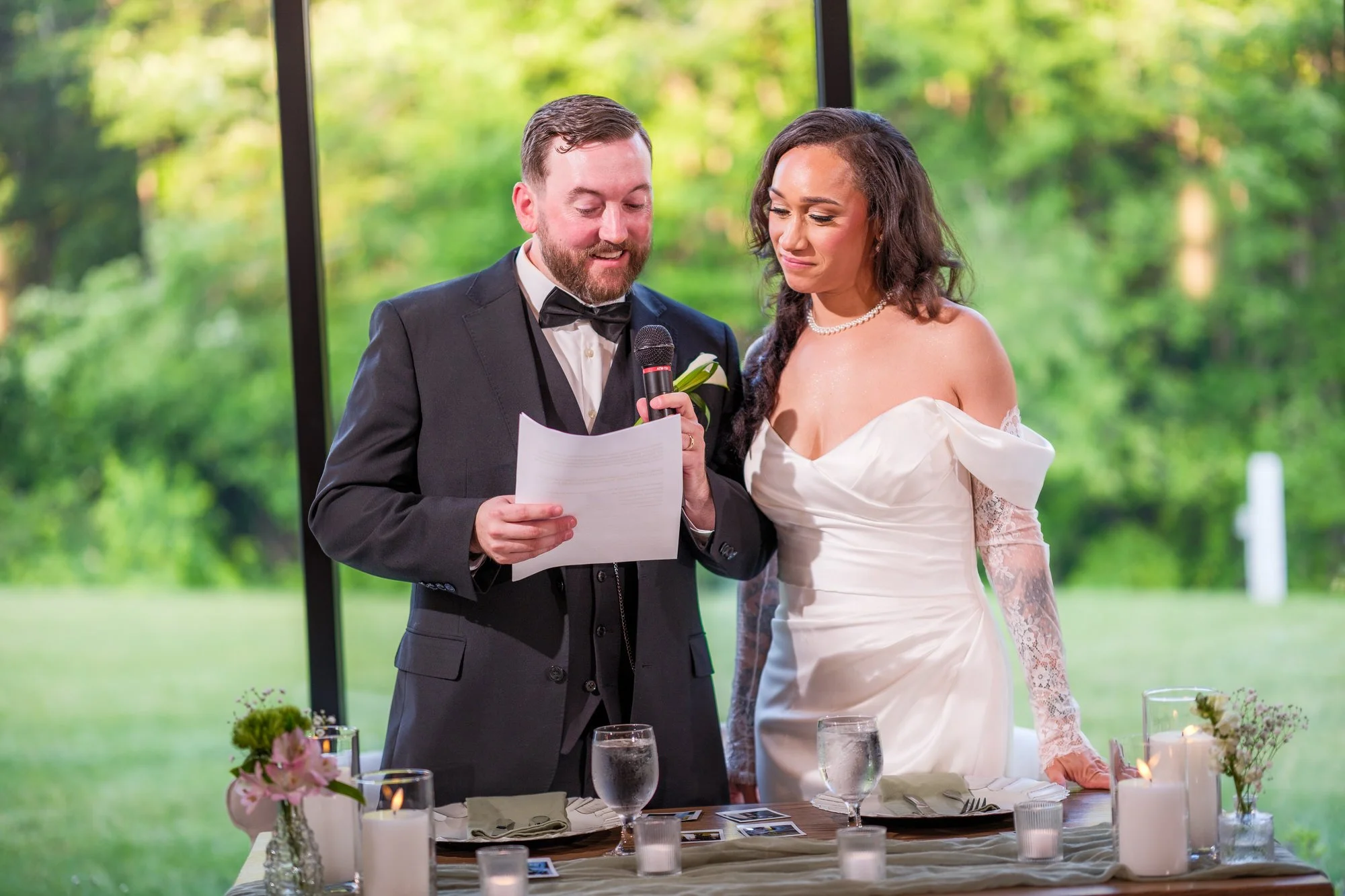 Bride and groom giving reception toast at Hyla Brook Estate
