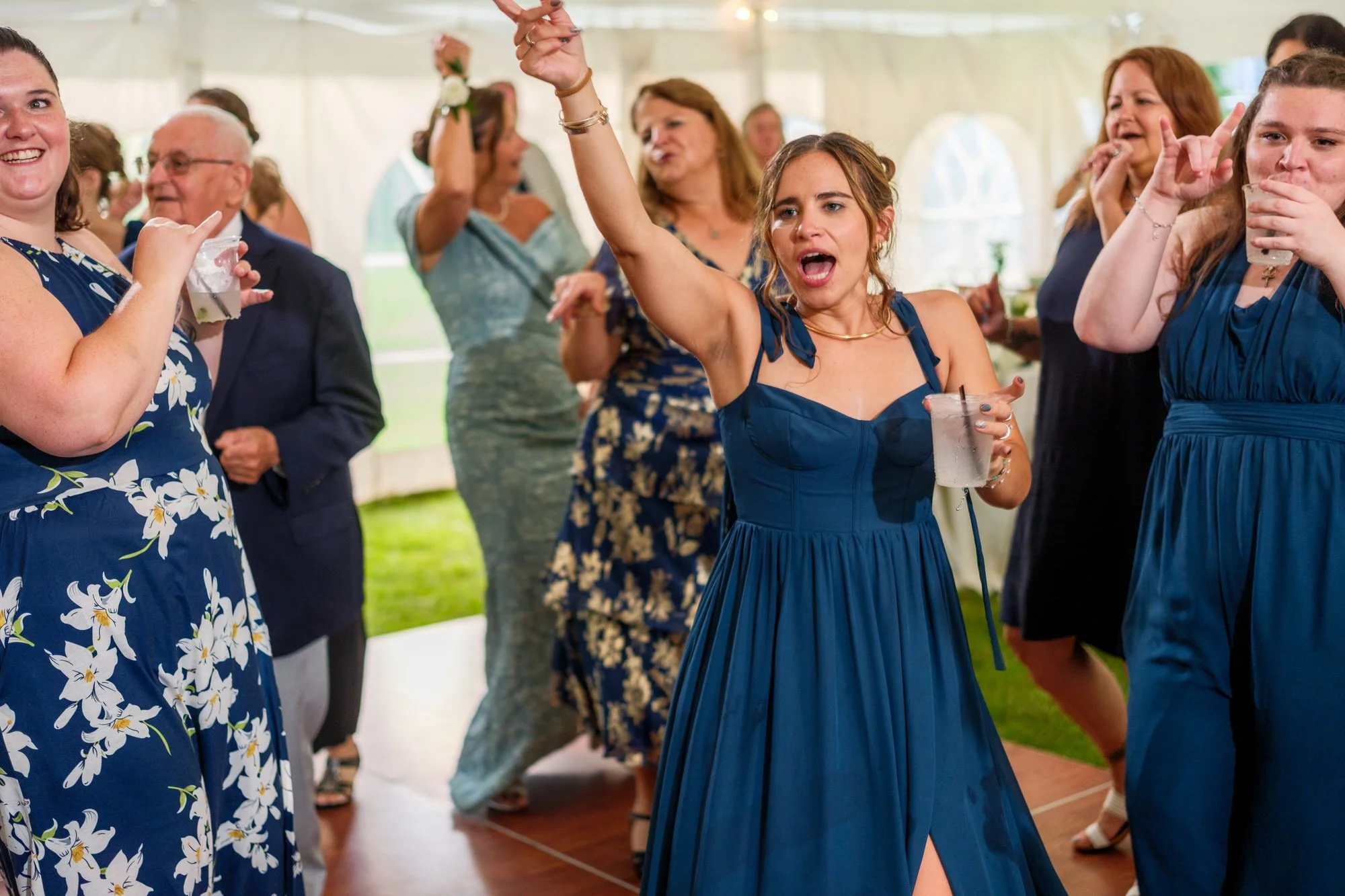 Wedding guests cheer during Lake Morey Resort reception in Vermont