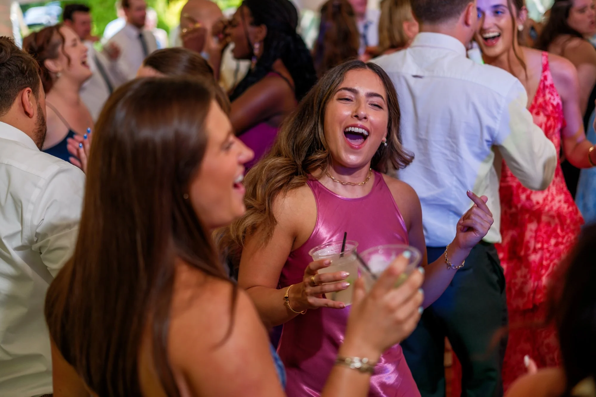Friends celebrate on the dance floor at Lake Morey Resort wedding reception