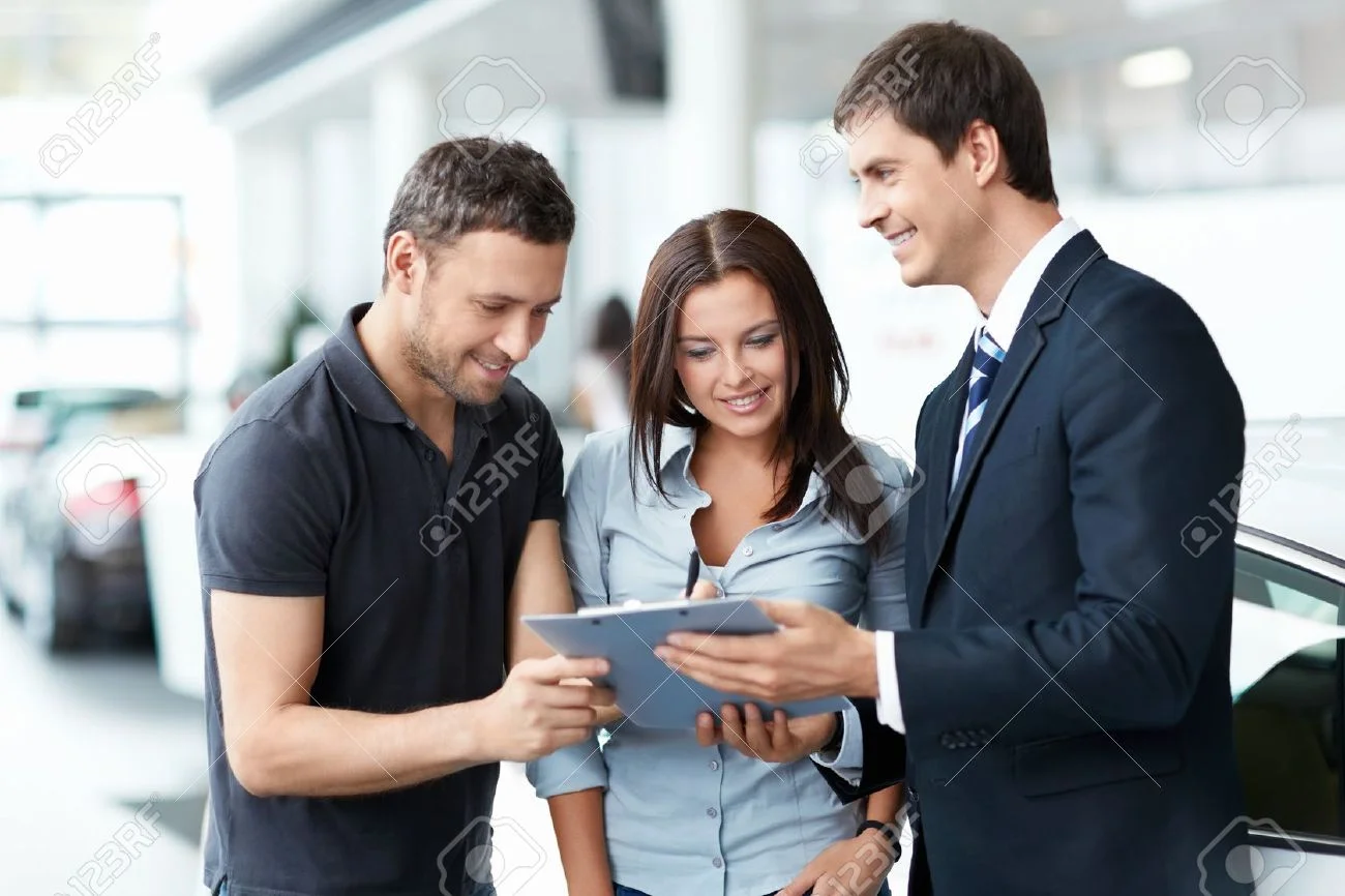 16058543-Young-couple-buys-a-car-Stock-Photo-car-service-customer.jpg