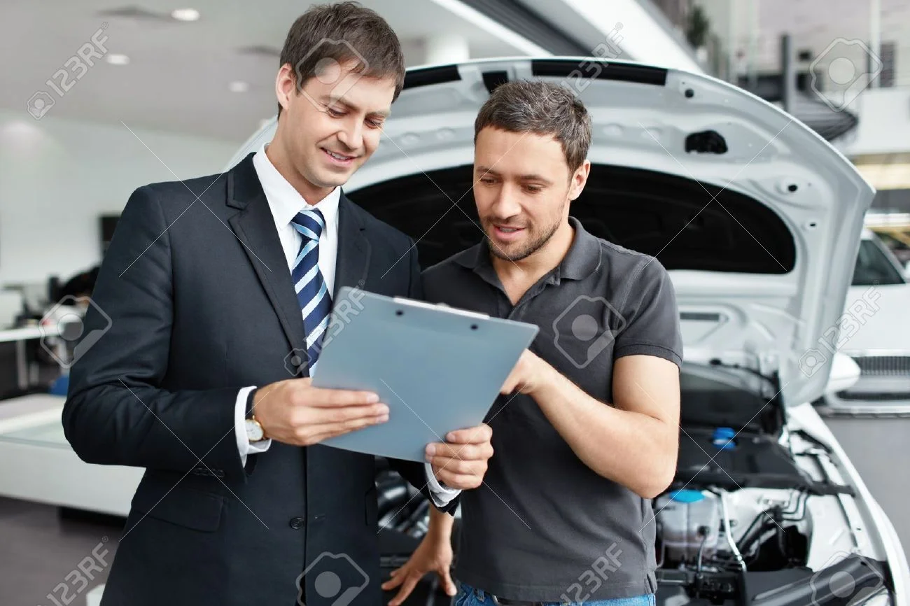 15896000-Young-man-buys-a-car-Stock-Photo-car-service-customer.jpg