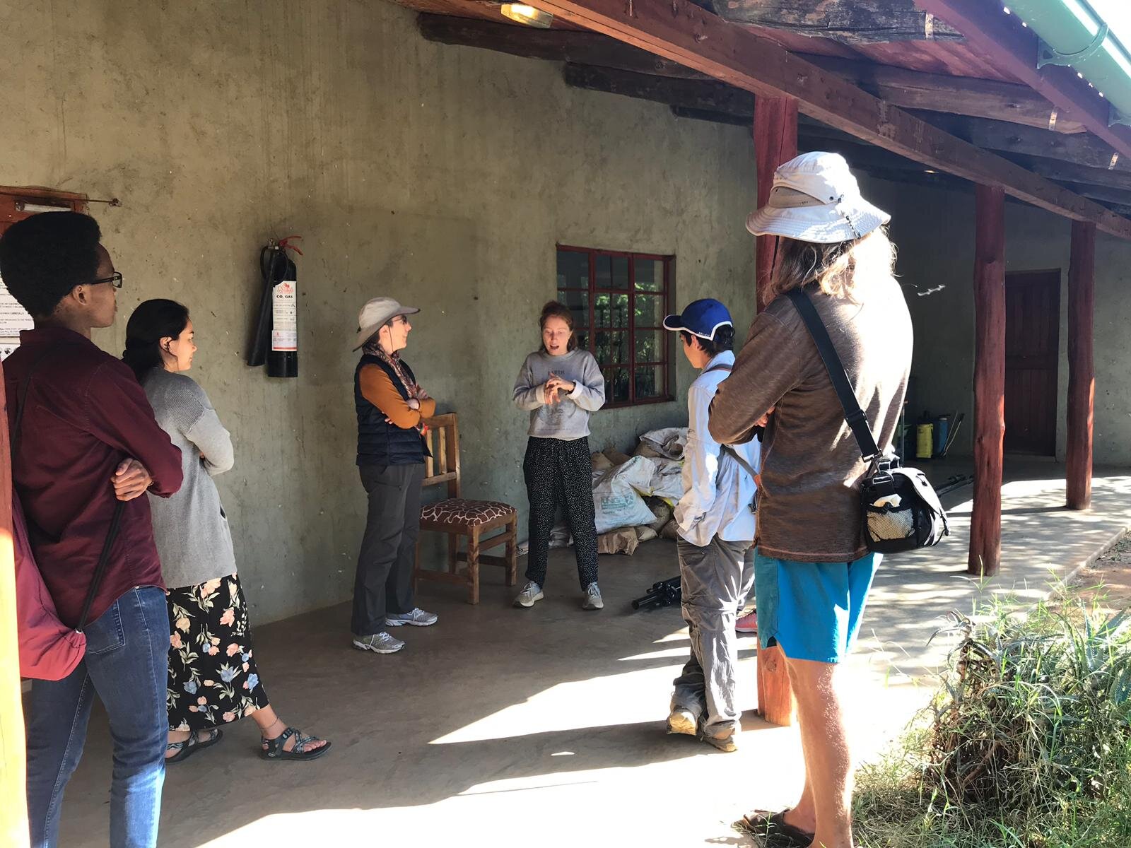 Rebecca Composto (centre right) and her mother Dr. Karen Winey (centre left) as Rebecca leads a tour of the Mpala grounds.