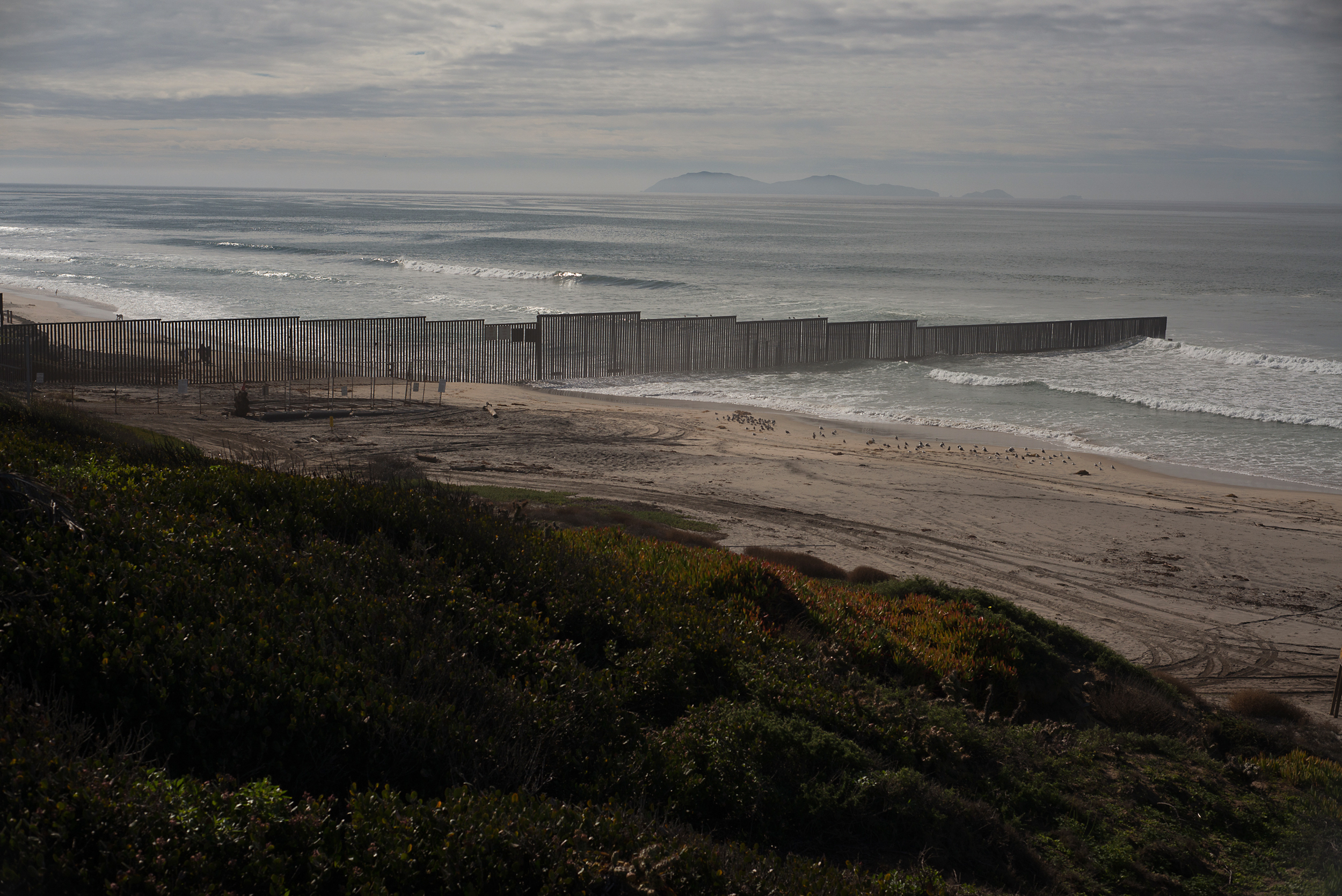 The U.S.-Mexico border fence runs out into the Pacific Ocean near Border Field State Park in Imperial Beach, Calif.