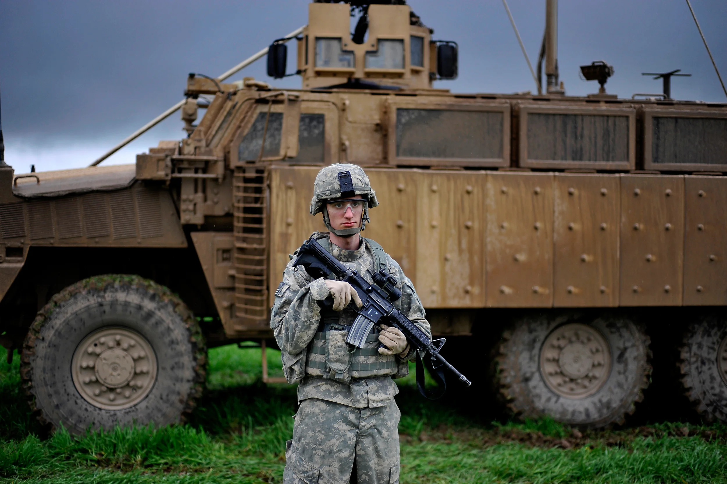 A U.S. soldier stands in a muddy field in Zumar, Iraq as soldiers begin building a combined security checkpoint in Feb. 2010.