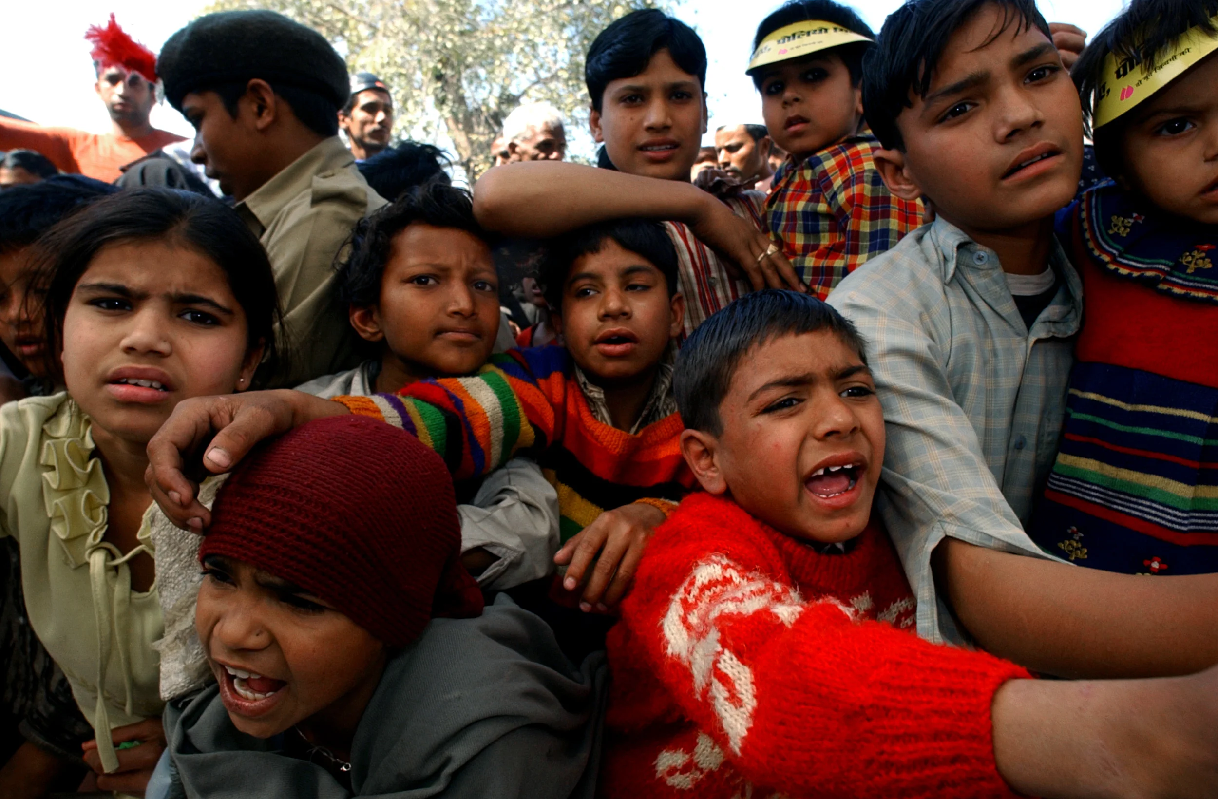 Children beg for small gifts that were handed out at an event where polio vaccines were distributed in Muzzafarnagar, a district in the polio endemic state of Uttar Pradesh, India during the countries National Immunization Days.