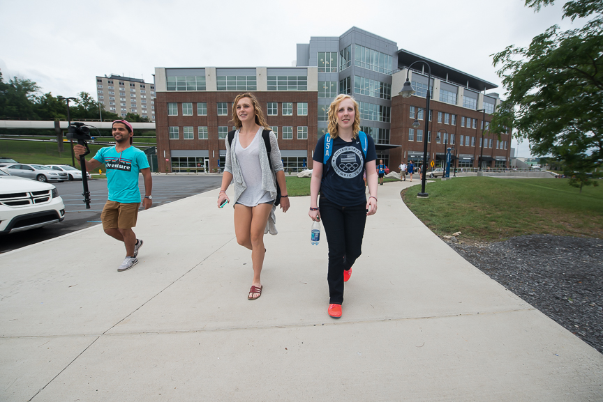 Ginny walks with Maddy Gardner, 20, a junior, left, on her first day of instruction for the fall semester at WVU on Wednesday, Aug. 17, 2016. 