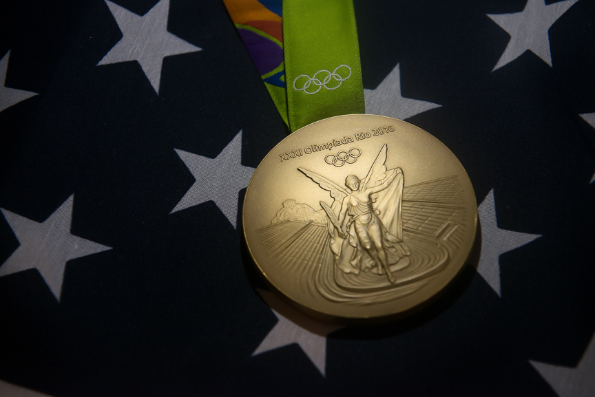 Ginny Thrasher's gold medal sits on an U.S. flag during a photoshoot on the campus on Wednesday, Aug. 17, 2016. 