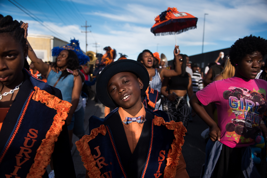 People march in the street during the Prince of Wales 88th anniversary second line parade in New Orleans' Irish Channel neighborhood on Oct. 9, 2016. 