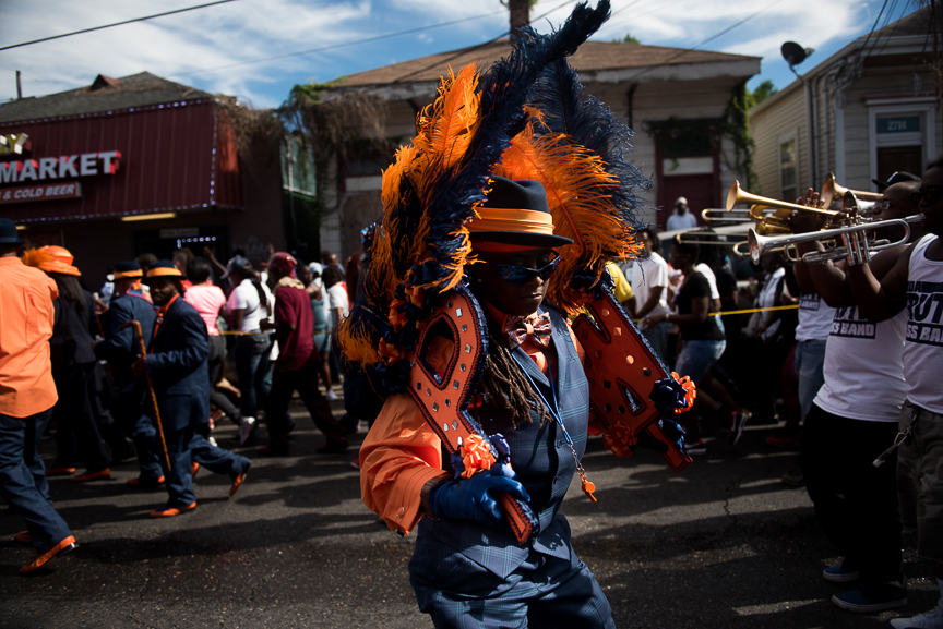 The Prince of Wales second line parade makes its way down a street of New Orleans' Irish Channel neighborhood on Oct. 9, 2016. 