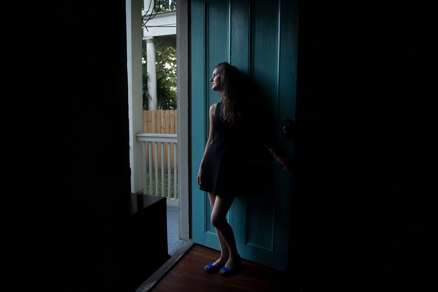 Steph looks out of the door of our Airbnb in New Orlean's Garden District. 