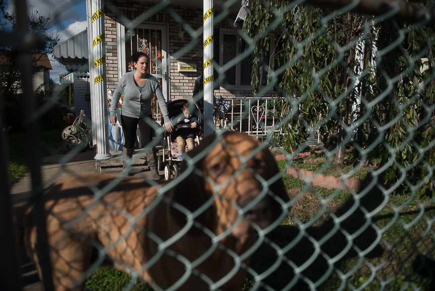 Courtney Lally, 23, stands with her daughter, Gianna, 2, at her home in Munhall, Pa., home on Tuesday, Oct. 25, 2016. Lally's sister, Jessica Lally, 25, and her boyfriend, Christopher Dilly, 26, were found dead by police after Jessica's 7-year-old daughter alerted a school bus driver that her parents were blue and she was unable to wake them. The two had overdosed on heroin.