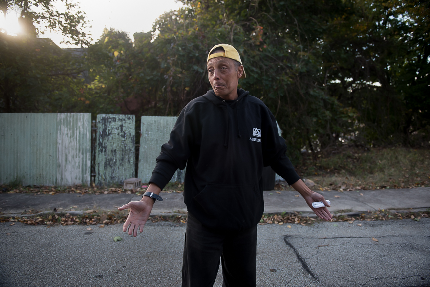 Harrold Nelson, 60, stands in the street in front of his home in McKeesport, Pa., on Oct. 25, 2016. Few homes remain on Nelson's block, many of those that do remain are abandoned.