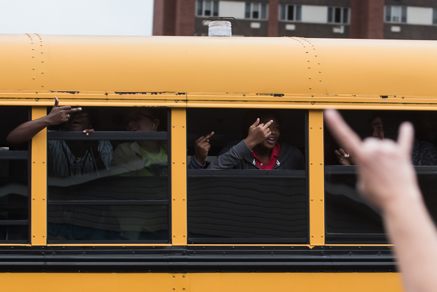 Students on a bus shout obscenities as they give the middle finger to Trump supporters lined up outside of the Cambria County War Memorial Arena prior to a Donald Trump campaign stop on October 21, 2016 in Johnstown, Pennsylvania. 