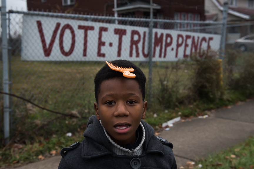 Antonio Lake, 6, walks in front of a Trump sign in Youngstown, Ohio on Nov. 23, 2016.
