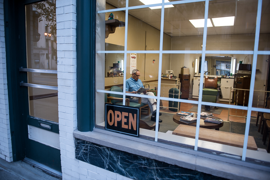 Tom Brophey, 77, sits in his barber shop along West 6th Street in East Liverpool, Ohio on Sept. 15, 2016. Brophey, who worked in the Crucible Steel plant, opened his barber shop after losing his job in the mill in 1982. "Everyone knows there's a problem, but no one knows how to fix it," he says speaking of the heroin problem the town faces. "Drugs are the economy now. It's like an infection. It spreads," he says.