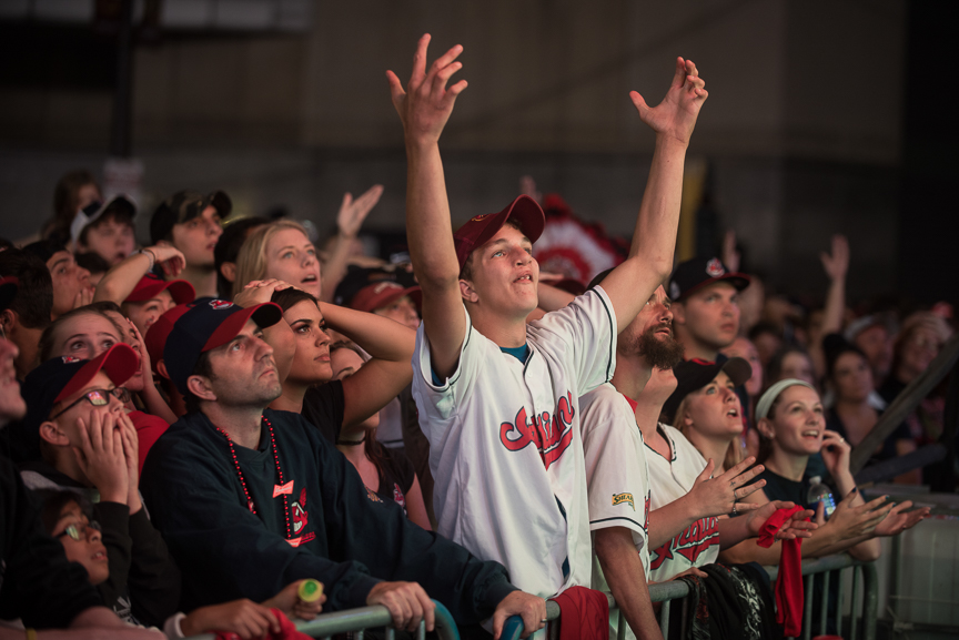 Fan react as the Cleveland Indians give up 3 runs in the the first inning as they watch on a big screen outside of Progressive Field during game 6 of the World Series on November 1, 2016 in Cleveland, Ohio.