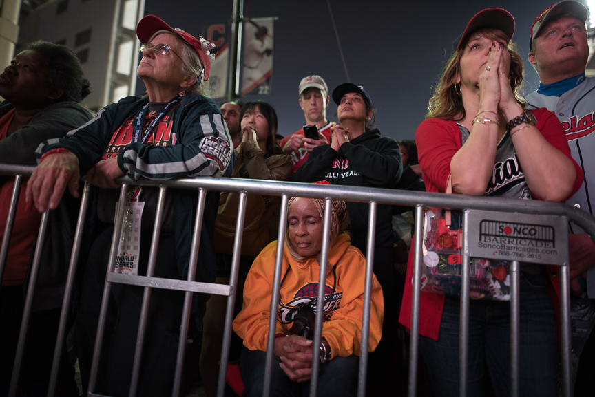 Fans react as they watch the big screen outside of Progressive Field during game 7 of the World Series between the Cleveland Indians and the Chicago Cubs on November 2, 2016 in Cleveland, Ohio.