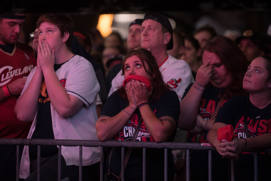 Fans react as they watch a big screen outside of Progressive Field during game 7 of the World Series between the Cleveland Indians and the Chicago Cubs on November 2, 2016 in Cleveland, Ohio. The Chicago Cubs defeated the Cleveland Indians 8-7. 