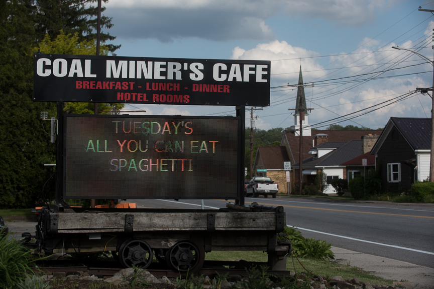 A sign for the Coal Miner's Cafe sits along U.S. Route 30 on May 18, 2017 in Jennerstown, Pa. Justin Merriman for The Wall Street Journal