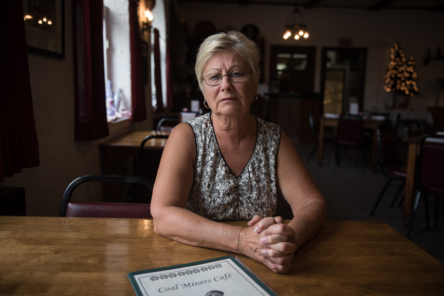 Betty Rhoads, who owns the Coal Miner's Cafe with her husband, John, sits at one of the restaurant's tables on May 18, 2017 in Jennerstown, Pa. "I've seen the good day's of coal," says Rhoads; her father owned several pick and shovel coal mines. "I can remember when there was mines all over these hills," she says. While she's not optimistic about the coal mining industry, Rhoads is happy about the opening of the Acosta Deep Mine. "I want every mine that can reopen to reopen," she says. Justin Merriman for The Wall Street Journal