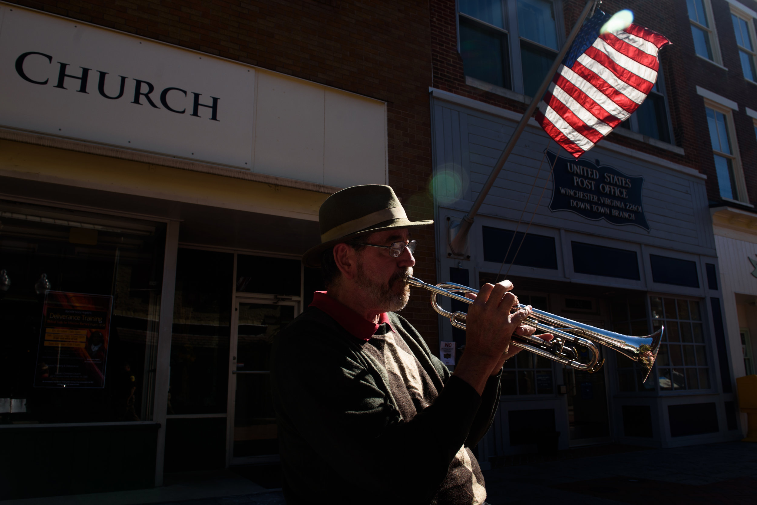 Daren Johnson, 64, busks on Tuesday, Oct. 17, 2017 along the promenade of the Loudoun Street Pedestrian Mall in Winchester, Va. Johnson, a retired school teacher and former supporter of Hillary Clinton, is exhausted by recent elections, but will vote in the upcoming gubernatorial election. Being uninsured and relying on a free healthcare clinic he cares deeply about the state of healthcare in America. Read more about this story in The New York Post . 