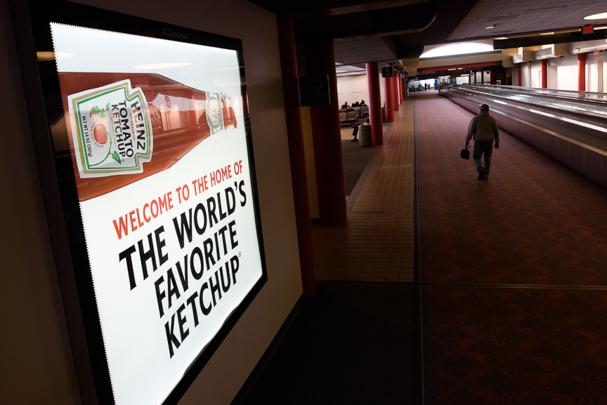  A traveler walks near a Heinz ketchup sign at the Pittsburgh International Airport on Thursday, December 14, 2017 in Moon, Pa. 
CREDIT: Justin Merriman for The Wall Street Journal 